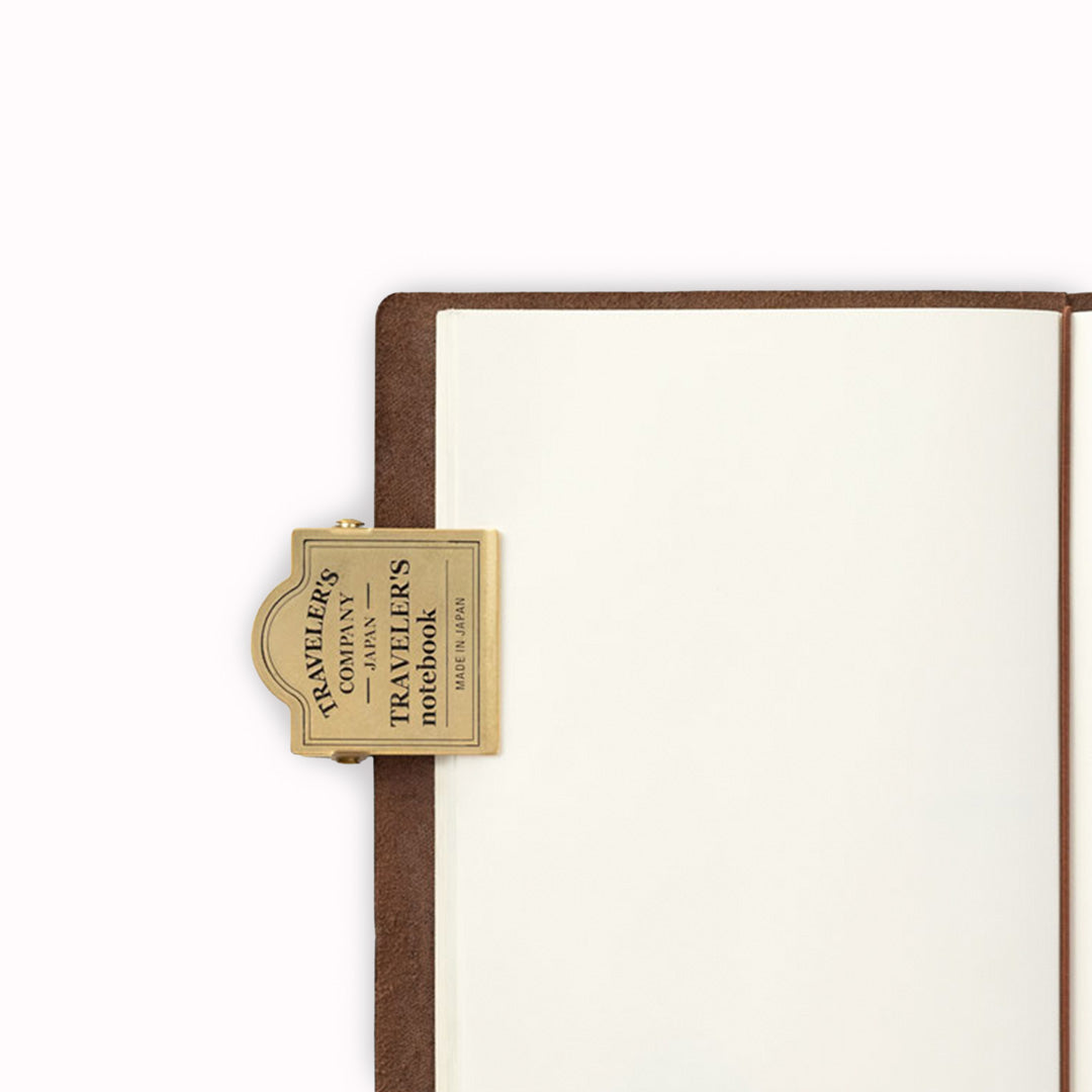 Made from solid brass with a stamped TRC logo, it’s designed to hold pages firmly in place—ideal for journalling, sketching or working flat on the move.