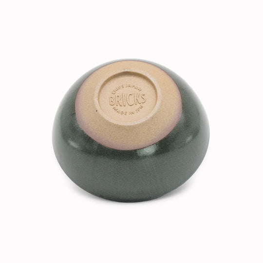 The Chips Inc. Bricks Bowl in green is a testament to functional design and aesthetic appeal. Crafted with a focus on usability and comfort, the bowl features a silhouette that is timeless and easy to hold.