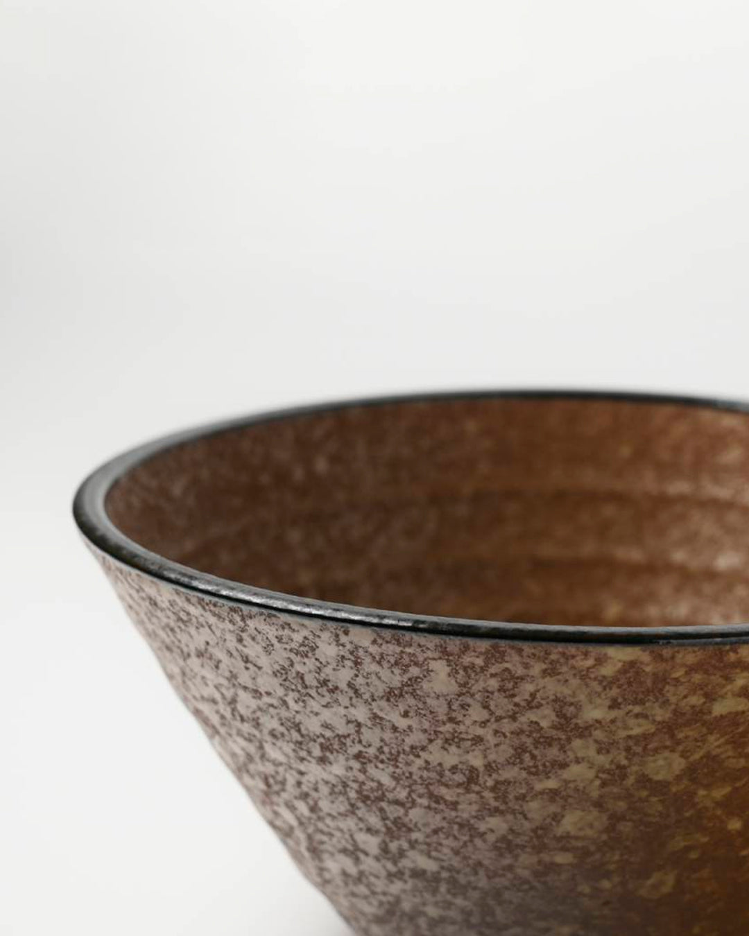 Rough textured Donburi bowl with matt glaze in a coppery brown shade that catches the light to reveal a golden shimmer. Suitable for serving rice, or any number of side dishes.