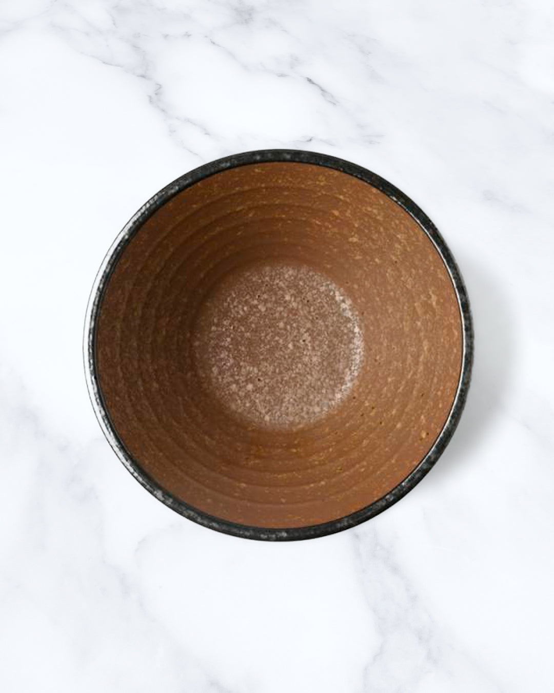 Rough textured Donburi bowl with matt glaze in a coppery brown shade that catches the light to reveal a golden shimmer. Suitable for serving rice, or any number of side dishes.
