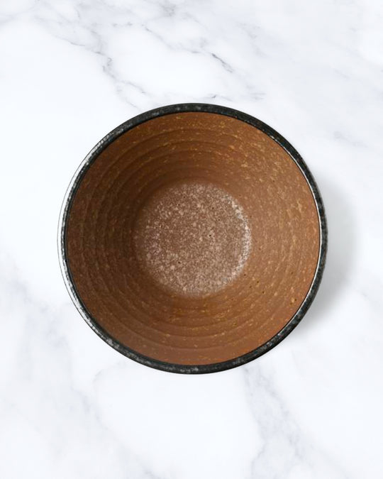 Rough textured Donburi bowl with matt glaze in a coppery brown shade that catches the light to reveal a golden shimmer. Suitable for serving rice, or any number of side dishes.