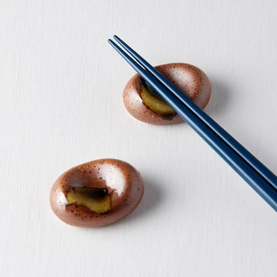 This ceramic pebble from MIJ makes a perfect chopstick rest, the majority of the pebble is a brown colour with lovely green splashes. 