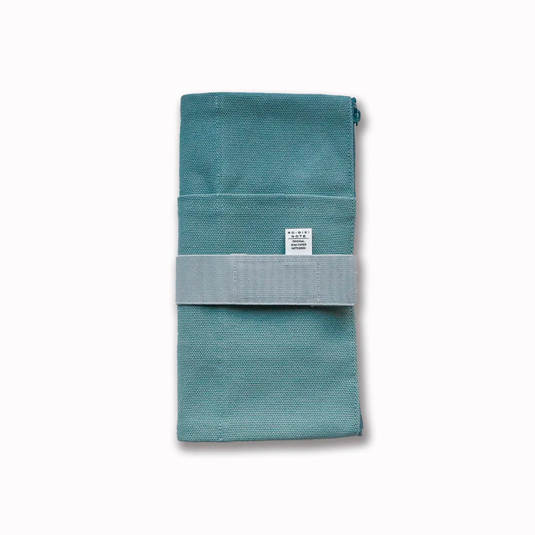 The Canvas Cover is a folding stationery pouch with a zipper compartment and internal sleeve for inserting 1 notebook cover. There are 3 additional pockets on the exterior for slim stationery tools such as pens or a ruler.