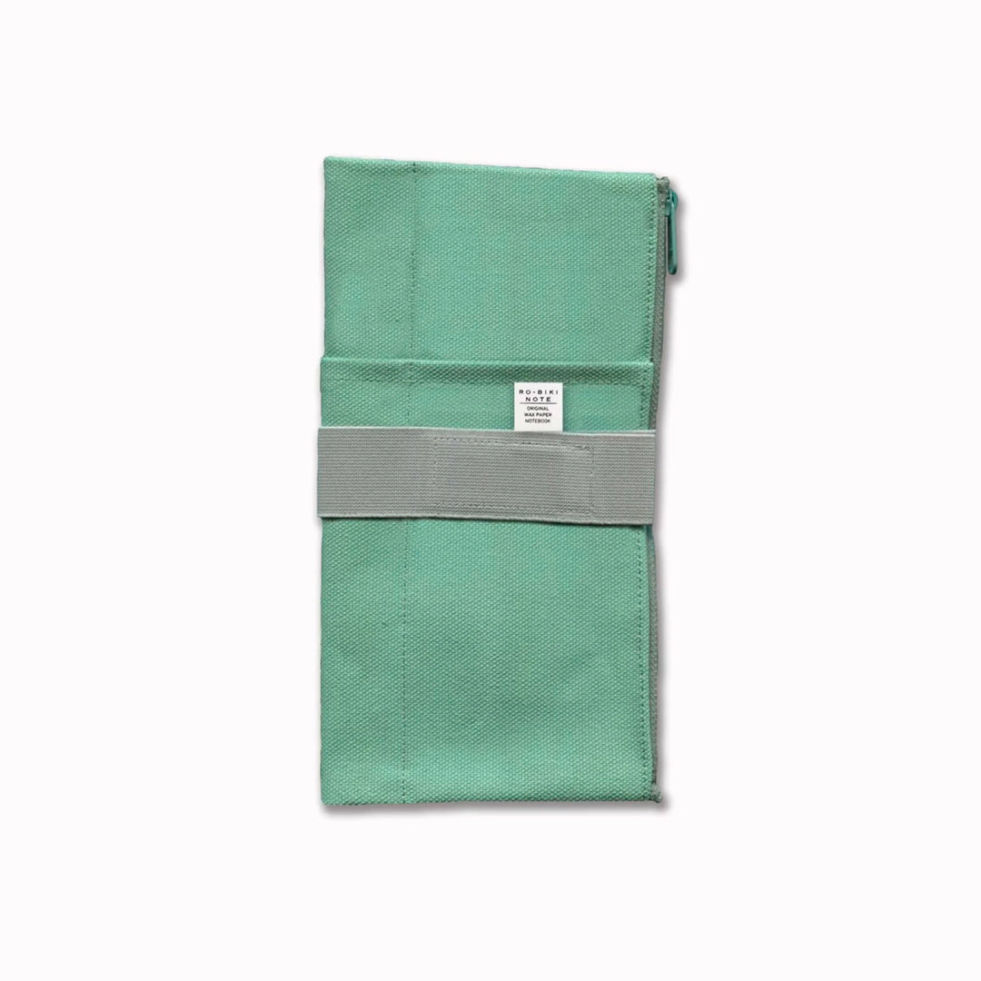 The Canvas Cover is a folding stationery pouch with a zipper compartment and internal sleeve for inserting 1 notebook cover. There are 3 additional pockets on the exterior for slim stationery tools such as pens or a ruler.