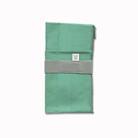 The Canvas Cover is a folding stationery pouch with a zipper compartment and internal sleeve for inserting 1 notebook cover. There are 3 additional pockets on the exterior for slim stationery tools such as pens or a ruler.
