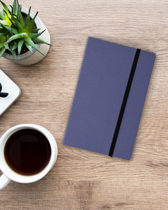 The Bullet Jotter by Yamamoto Paper is a modular note-taking system comprising an outer cover jacket with internal space to hold 2 bullet paper pads. 