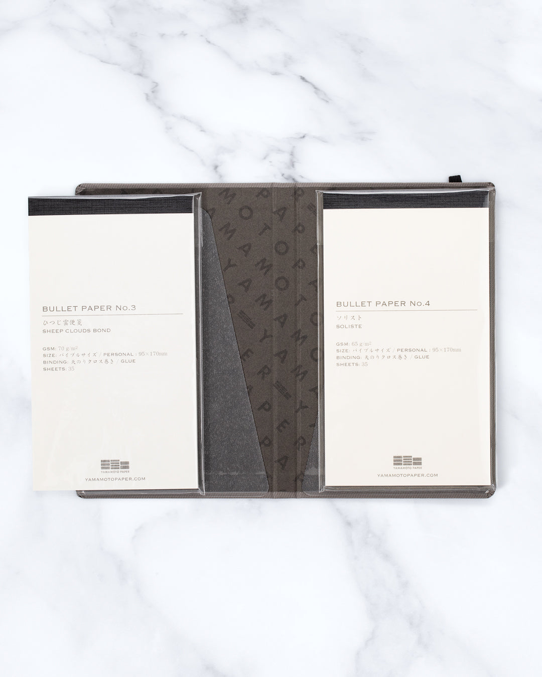 The Bullet Jotter by Yamamoto Paper is a modular note-taking system comprising an outer cover jacket with internal space to hold 2 bullet paper pads. 