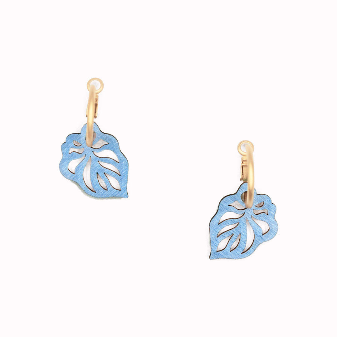 Reversible leaf hoop earrings from Materia Rica in a calm pale blue and mint green colourway.