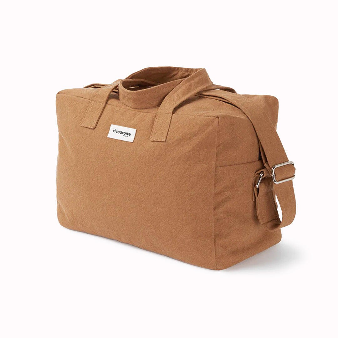 Camel Sauval bag from Parisian brand Rive Droite is a compact everyday messenger bag made from recycled cotton. Viewed from an angle