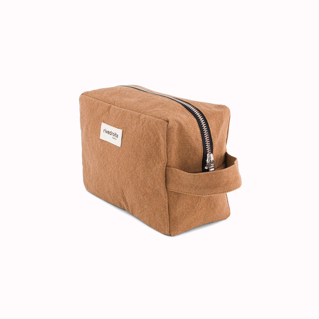 Camel, Tournelles XL. A zippered pouch in a pleasing cube shape which is large enough for essential make up items on a weekend away. pictured at an angle