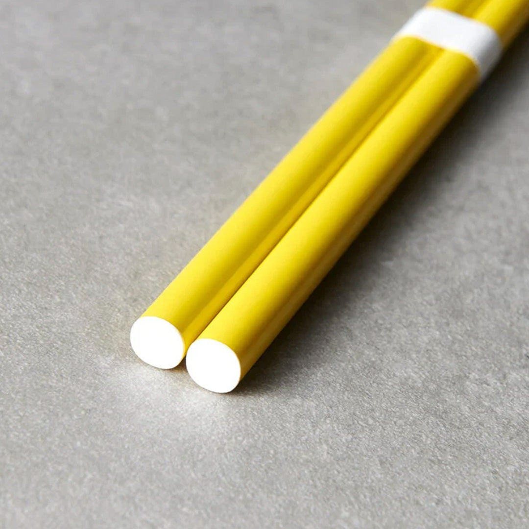 Canary Yellow lacquerware finish with white accent chopsticks from Made in Japan. This Chopstick collection is designed and made at the Zumi workshop in Fukui prefecture, Japan. This region of Japan has a 1500-year-old history of crafting with Lacquer.&nbsp;