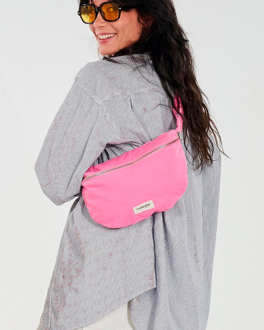 The Custine Belt Bag by Rive Droite Paris is a compact belt bag made from a Candy Pink recycled cotton fabric.