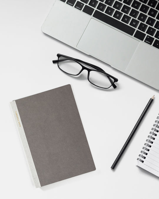 The notebook has 88 sheets / 176 pages of plain 73gsm Canopus paper and includes a removable guide sheet with grid layout on one side and ruled layout on the other.