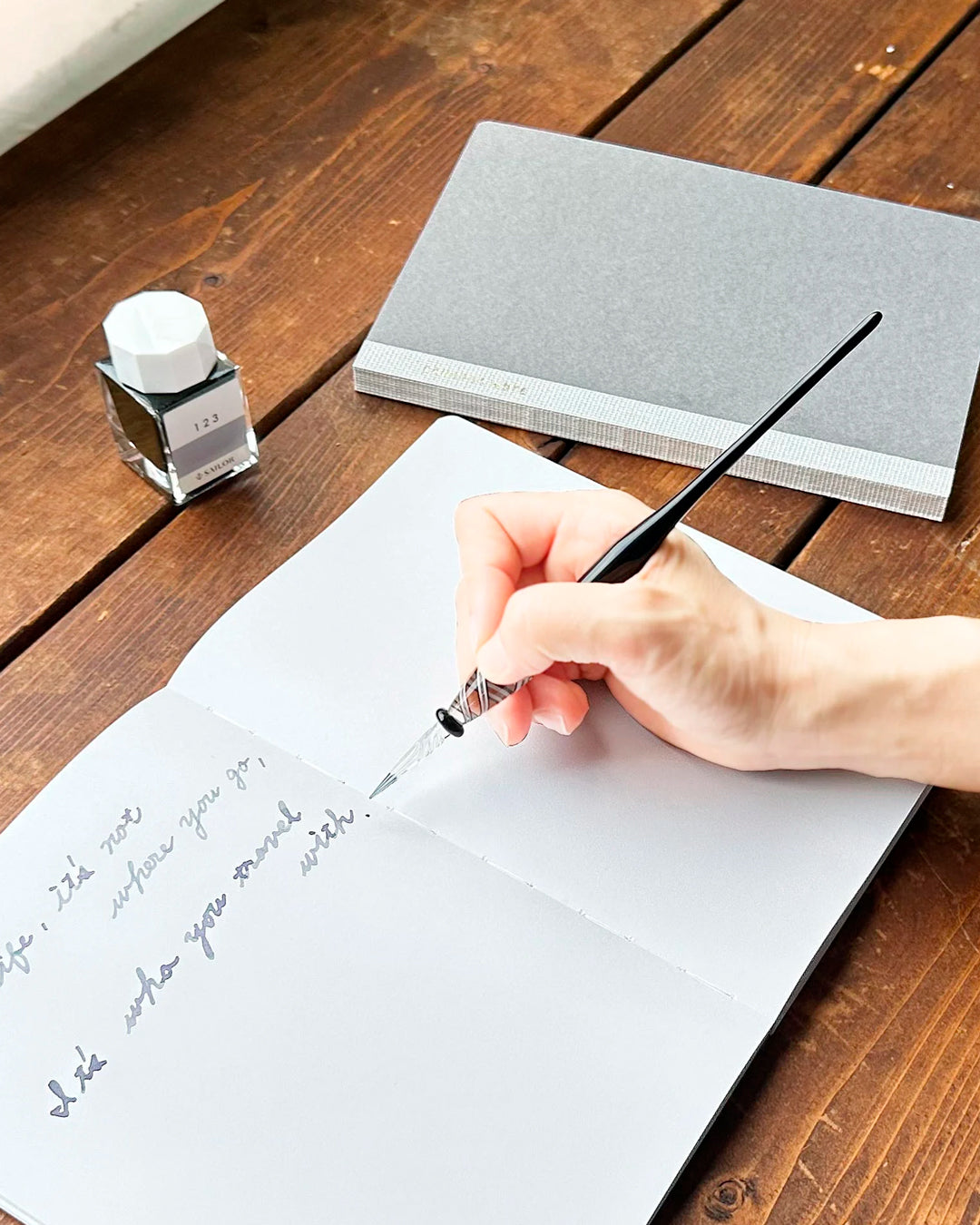 The notebook has 88 sheets / 176 pages of plain 73gsm Canopus paper and includes a removable guide sheet with grid layout on one side and ruled layout on the other.