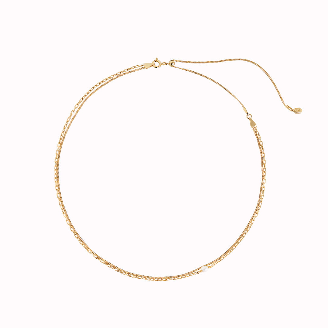 From Maria Black - Crafted from 925 Sterling Silver, this 22K Gold Plated Cantare Necklace features 1 baroque freshwater pearl measuring 4-5 mm in size