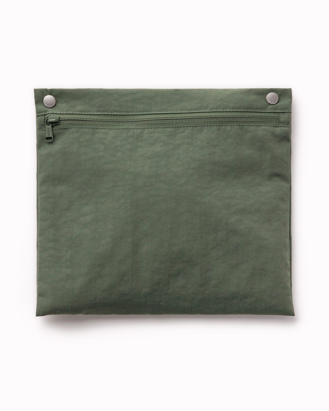 The BAGGU Cloud Carry-On is a spacious travel bag sized for overhead storage, with a trolley sleeve for easy attachment to your roller luggage. 