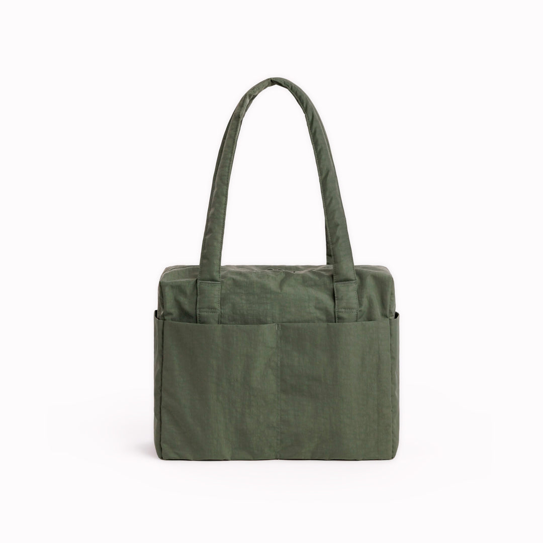 Made from recycled heavyweight nylon in a muted green colourway, it holds its shape without feeling rigid.