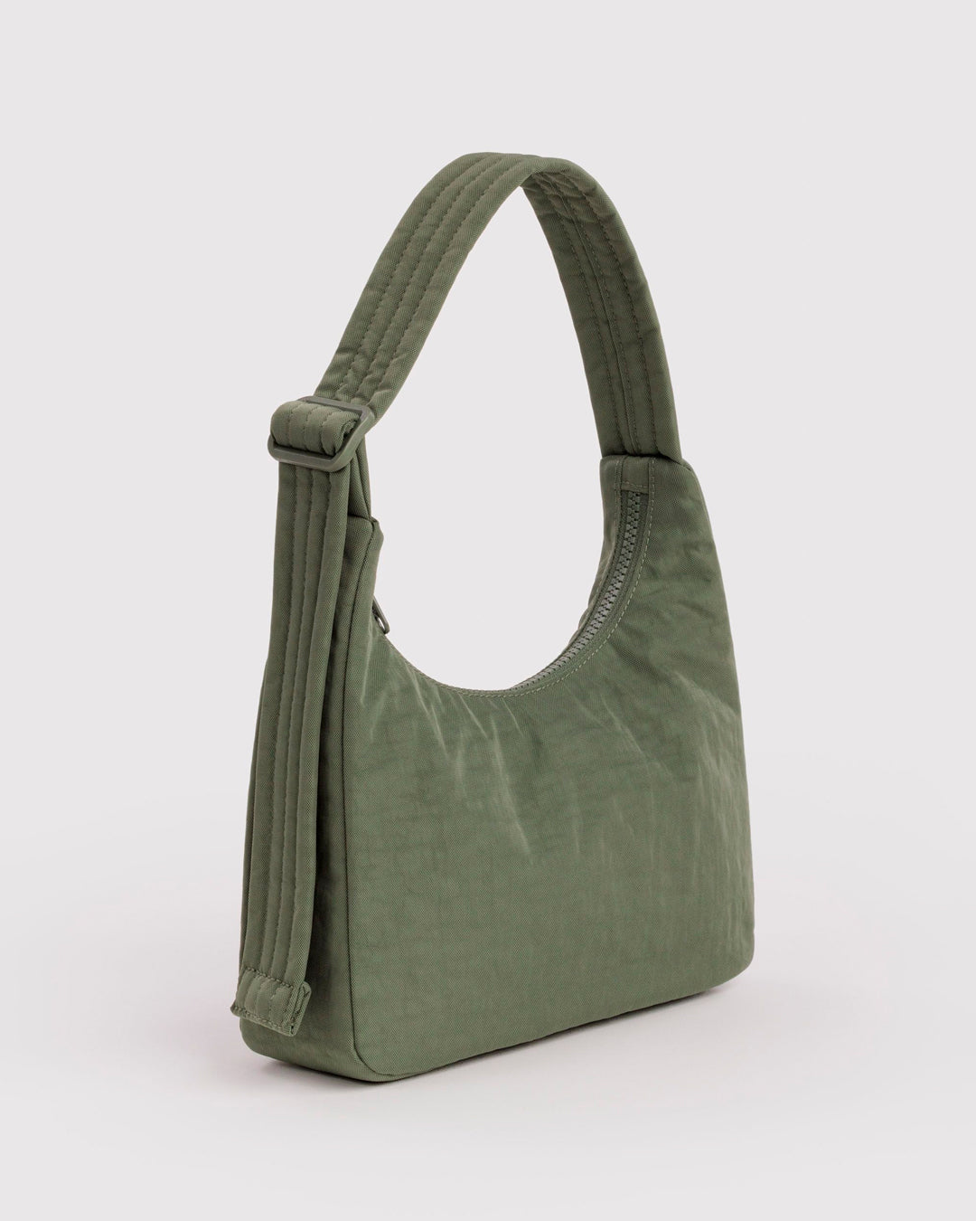 A compact version of BAGGU's signature shoulder bag, finished in a muted Caper colourway. The softly structured shape sits neatly under the arm