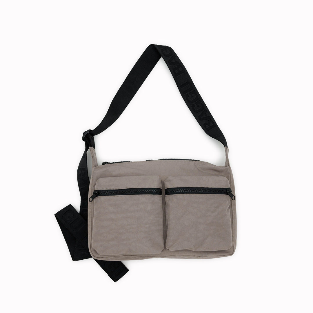 Made from 100% recycled heavyweight nylon with a recycled ripstop nylon lining, this bag reflects a commitment to sustainability. Its adjustable 47" logo strap provides comfort and adaptability, making it ideal for casual outings or daily errands. A perfect blend of practicality and eco-conscious design.
