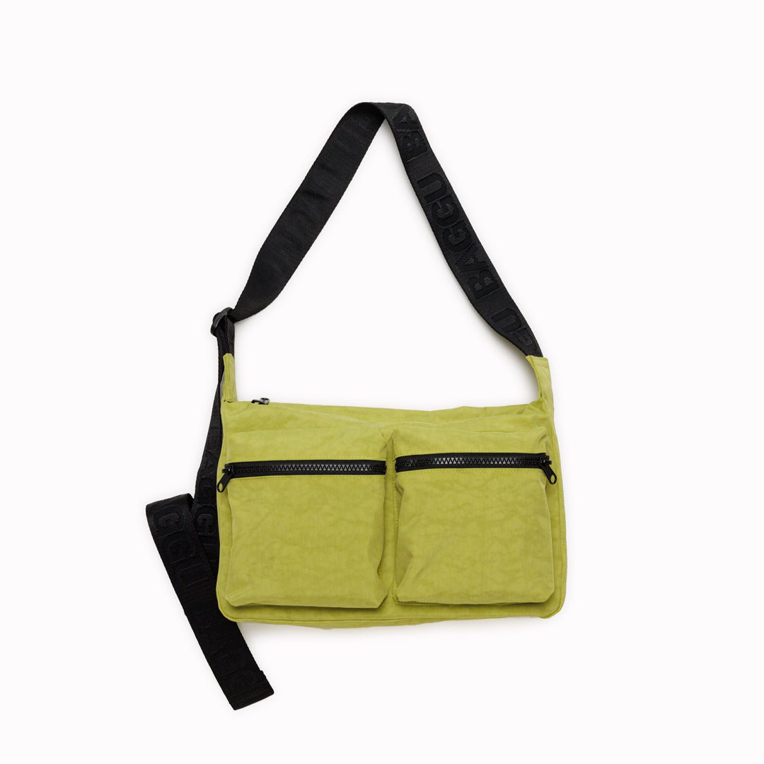 Made from 100% recycled heavyweight nylon with a recycled ripstop nylon lining, this bag reflects a commitment to sustainability. Its adjustable 47" logo strap provides comfort and adaptability, making it ideal for casual outings or daily errands. A perfect blend of practicality and eco-conscious design.