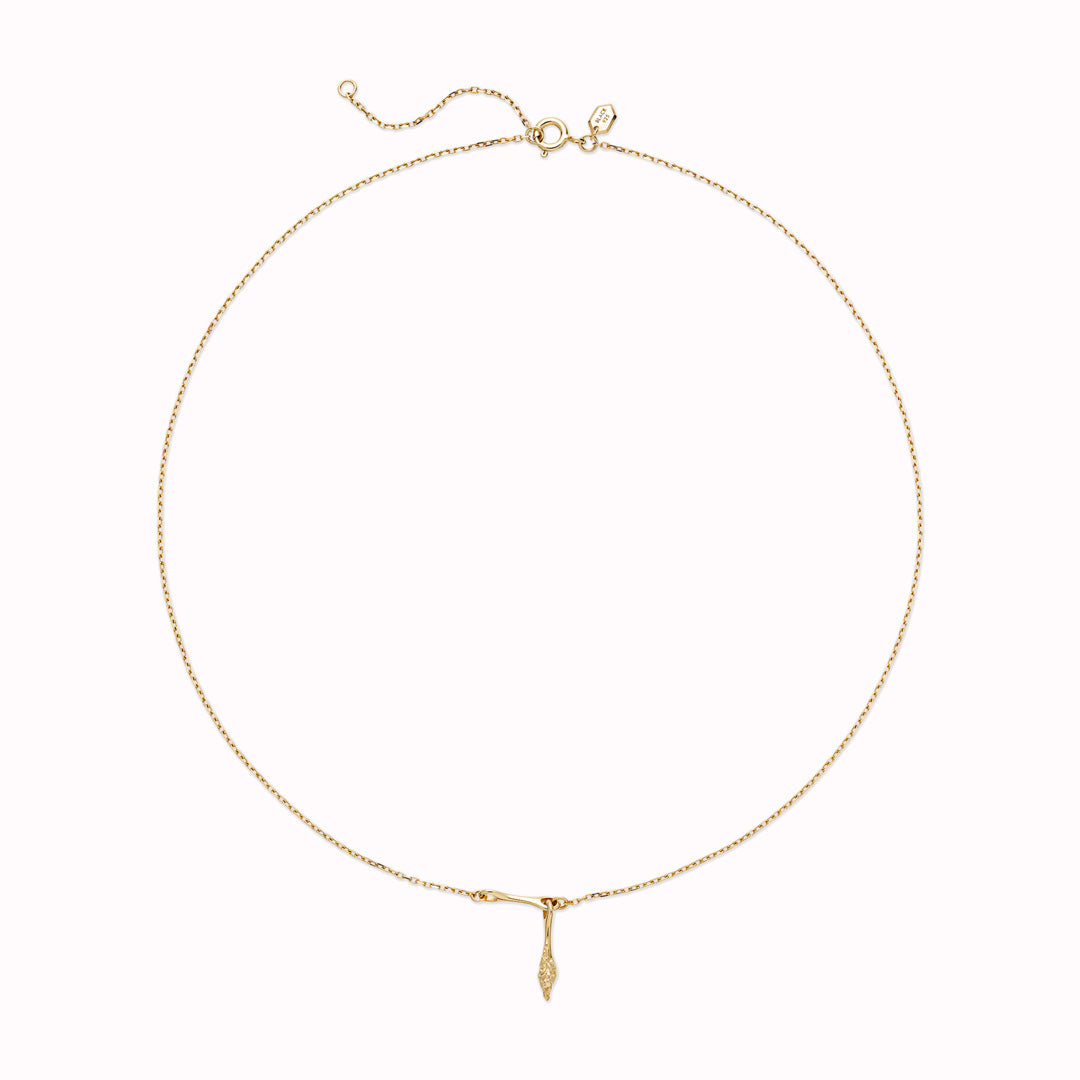 In Gold, Carrion necklace from Maria Black, a bold and captivating statement piece that elevates your style.