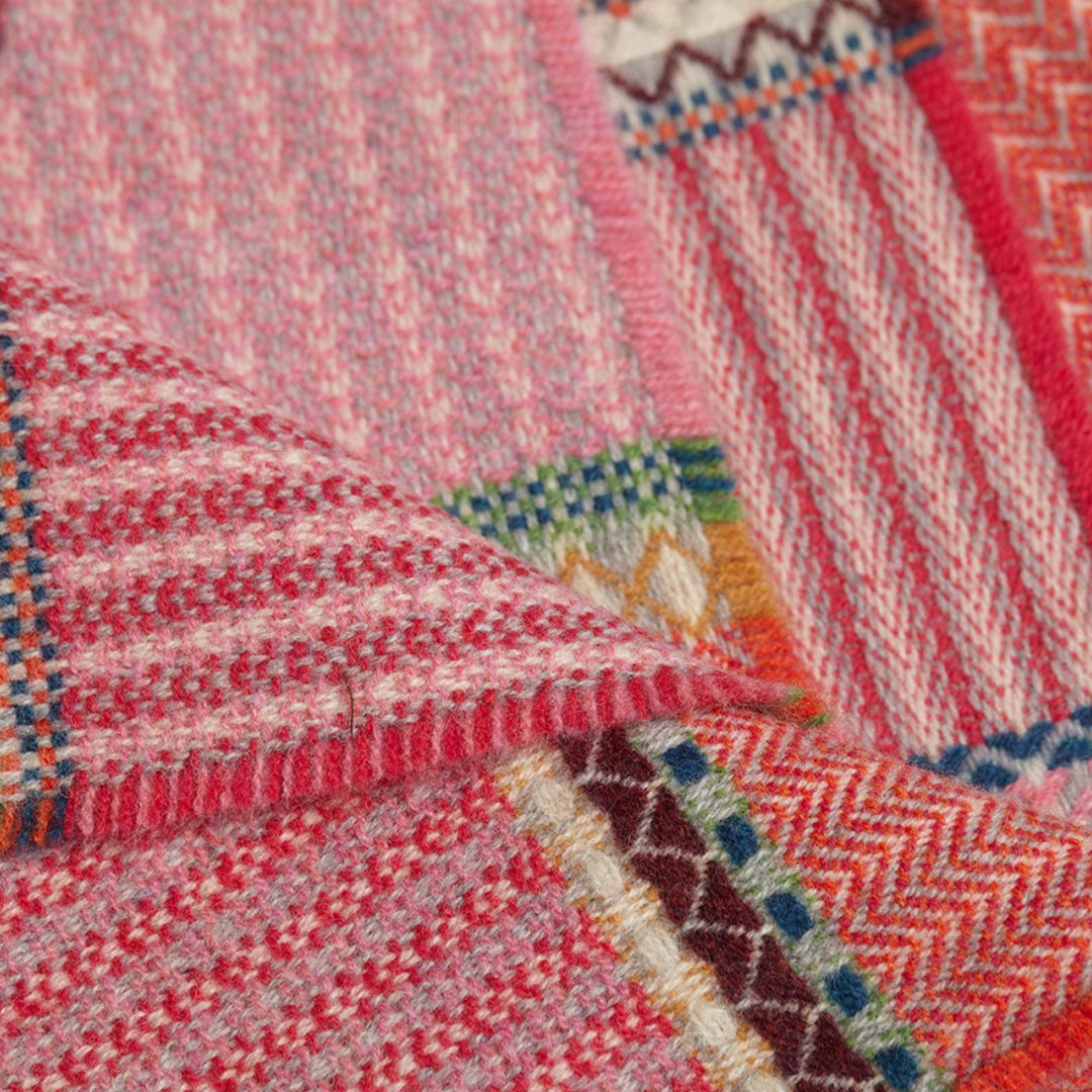 The Cassia lambswool Scarf by Wallace and Sewell showcases the intricate craft of textile design, blending traditional techniques with modern aesthetics.