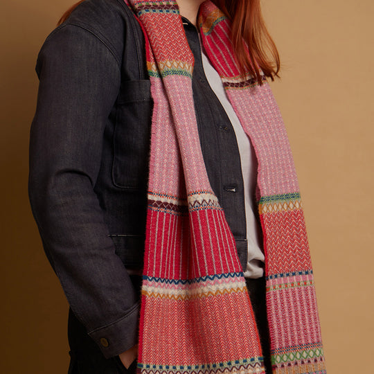 The Cassia lambswool Scarf by Wallace and Sewell showcases the intricate craft of textile design, blending traditional techniques with modern aesthetics.