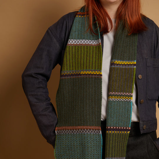 The Cassia lambswool Scarf by Wallace and Sewell showcases the intricate craft of textile design, blending traditional techniques with modern aesthetics.