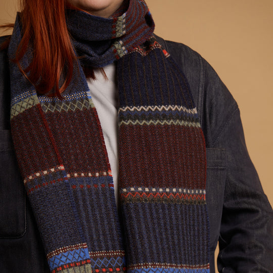 The Cassia lambswool Scarf by Wallace and Sewell showcases the intricate craft of textile design, blending traditional techniques with modern aesthetics.