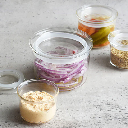 Kinto Cast Canisters are a blend of simplicity and functionality, designed with an "uninterfering design" concept. These canisters are crafted from heat-resistant glass and come with a silicone ring on the lid to ensure contents remain fresh.