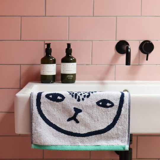 Donna Wilson has created a charming collection of Cat Towels, featuring a playful cat face design that adds a touch of whimsy to any bathroom.