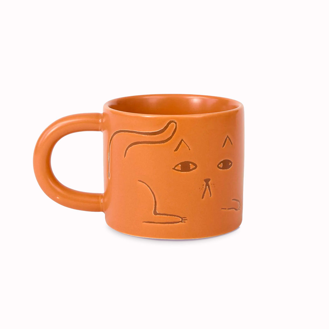 Cat mug on a ginger glazed stoneware base. Features a debossed cat image on 2 sides.