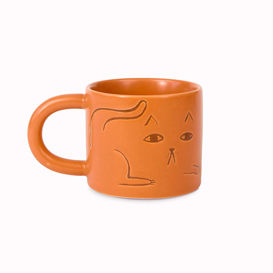Cat mug on a ginger glazed stoneware base. Features a debossed cat image on 2 sides.