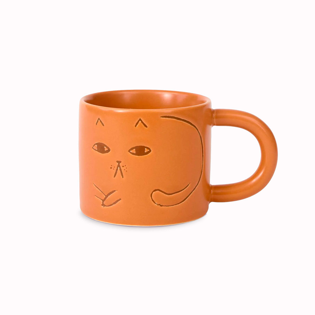 Cat mug on a ginger glazed stoneware base. Features a debossed cat image on 2 sides.