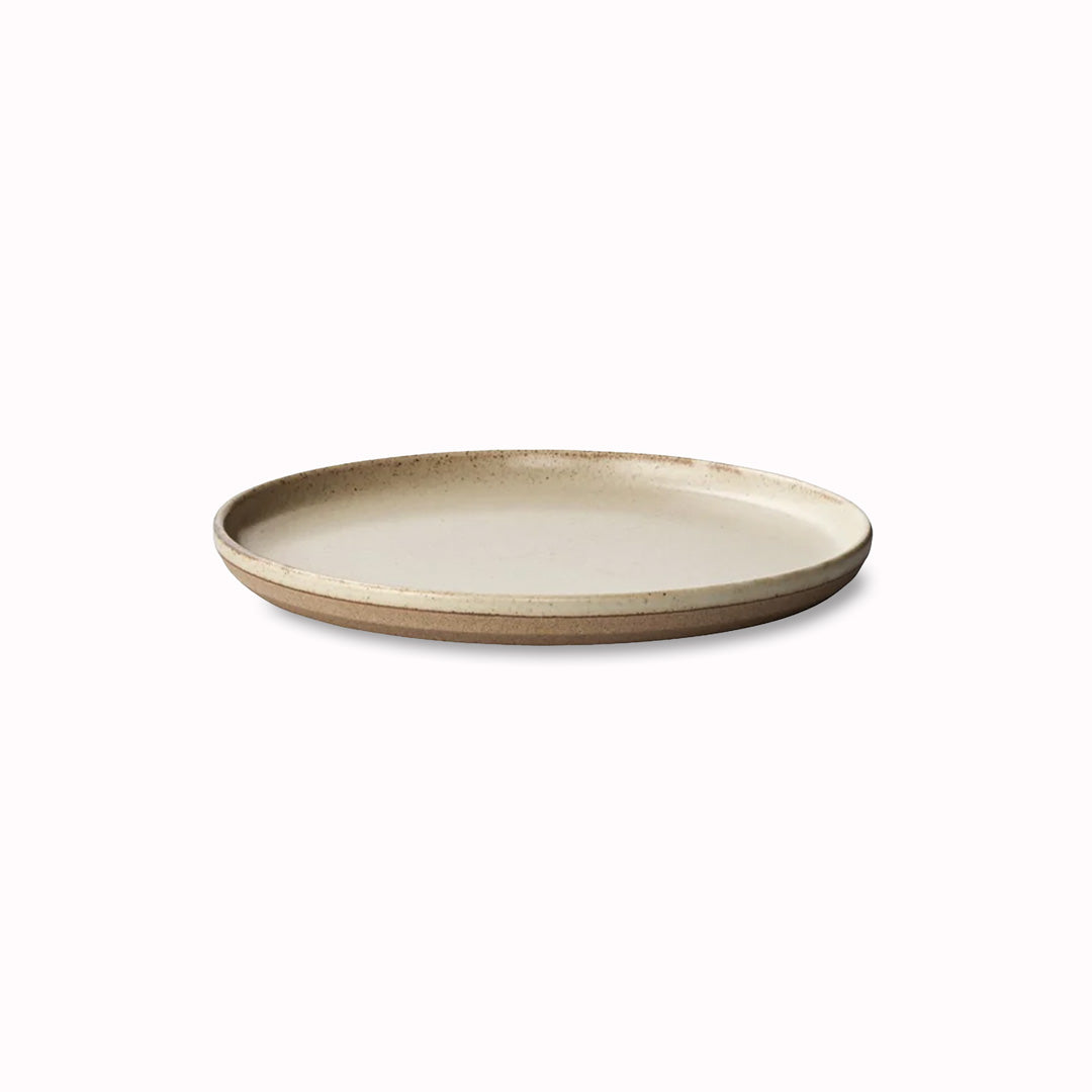 The Natural Ceramic Lab Plate by Kinto is an artisanal product of skilled craftsmanship and modern design.  It is made of sandstone from the Hasami region in Japan mixed with porcelain from the Amakusa Islands, which gives it a unique texture and colour.
