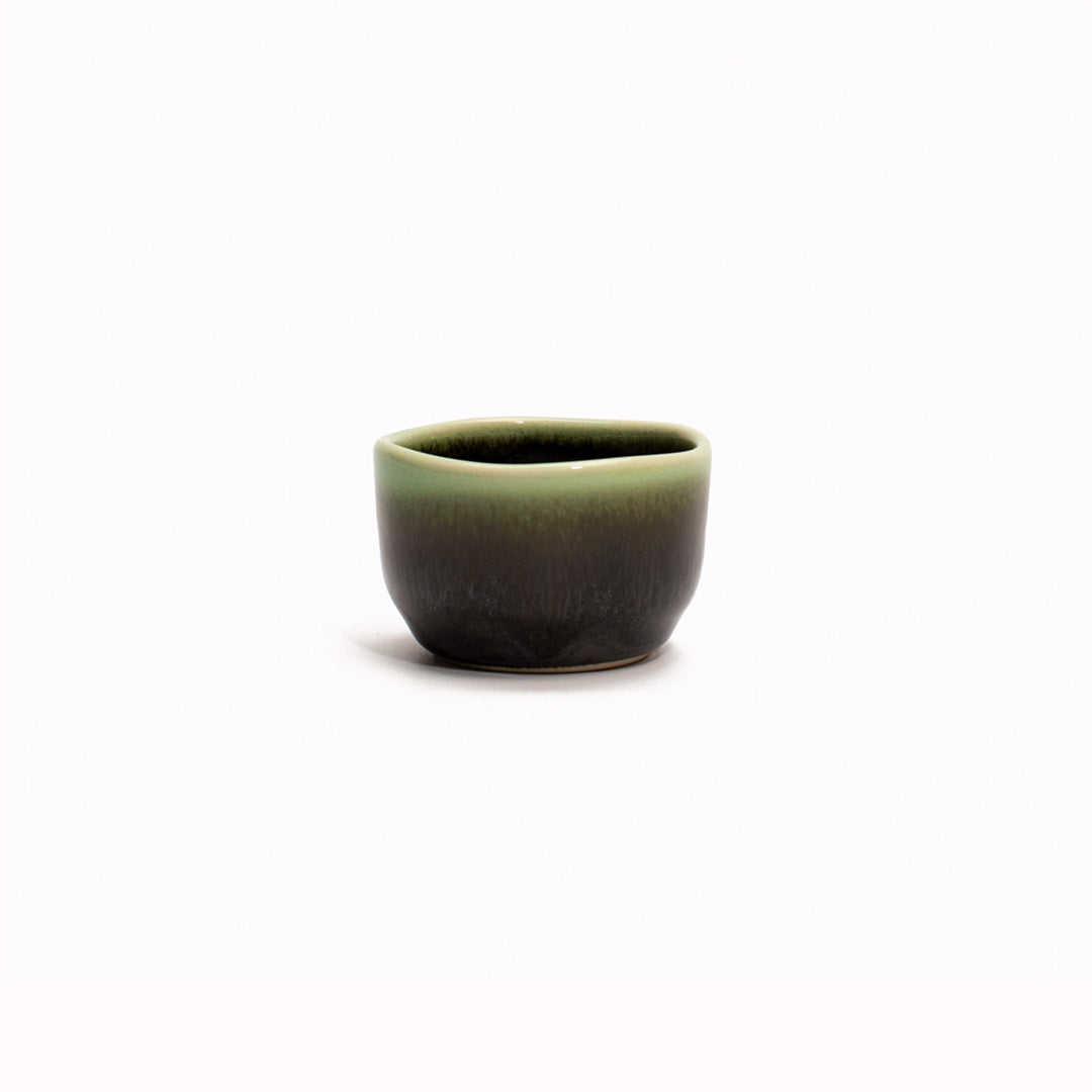 Black Green Sake Cup from Made in Japan. Working from a black base, the green is applied to the rim from above and allowed to drip down the cup to create an organic look.