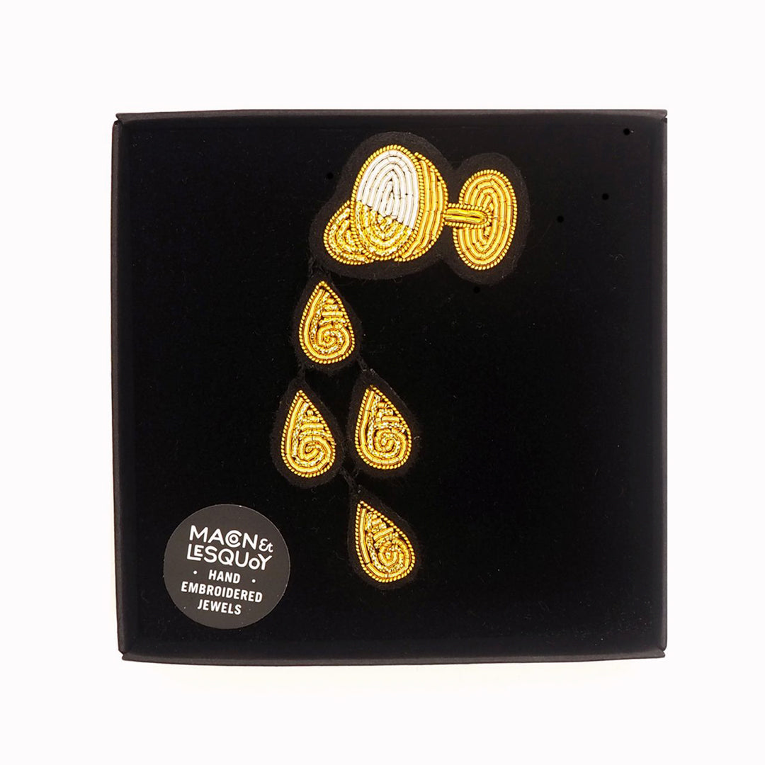 A celebration of the good times! Champagne Rain is a beautiful hand embroidered brooch by Parisian fashion accessory brand Macon et Lesquoy.