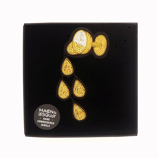 A celebration of the good times! Champagne Rain is a beautiful hand embroidered brooch by Parisian fashion accessory brand Macon et Lesquoy.