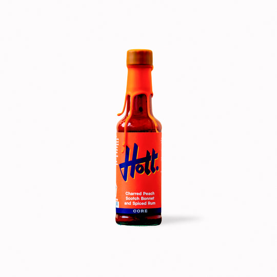 This unique sauce boasts a distinctive flavour profile, combining the sweetness of charred peaches with the warmth of Scotch bonnets and the aromatic complexity of spiced rum, featuring notes of ginger, cinnamon, cloves, and vanilla.