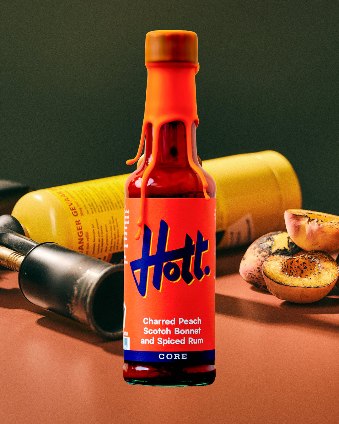 This unique sauce boasts a distinctive flavour profile, combining the sweetness of charred peaches with the warmth of Scotch bonnets and the aromatic complexity of spiced rum, featuring notes of ginger, cinnamon, cloves, and vanilla.