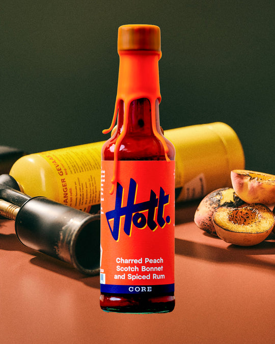 This unique sauce boasts a distinctive flavour profile, combining the sweetness of charred peaches with the warmth of Scotch bonnets and the aromatic complexity of spiced rum, featuring notes of ginger, cinnamon, cloves, and vanilla.