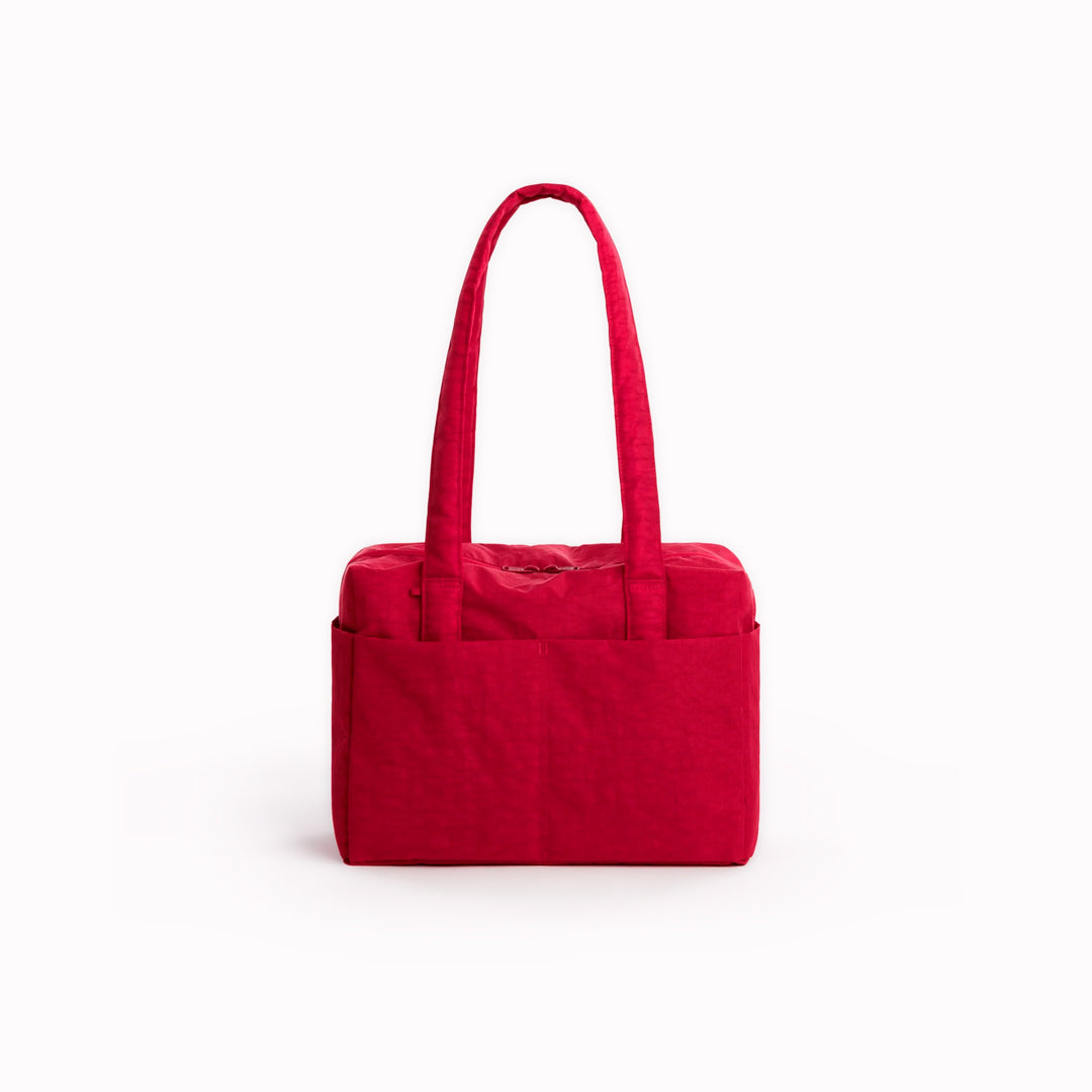 A compact carry-on built around movement. This scaled-down version of BAGGU’s Cloud series keeps the same soft structure but tightens the proportions for under-seat travel and everyday carry.