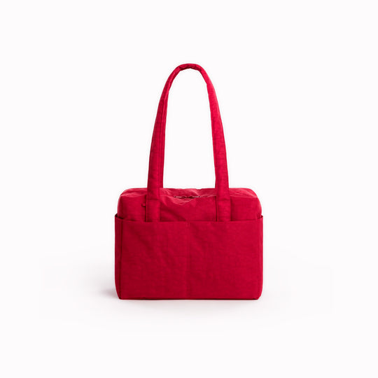 A compact carry-on built around movement. This scaled-down version of BAGGU’s Cloud series keeps the same soft structure but tightens the proportions for under-seat travel and everyday carry.