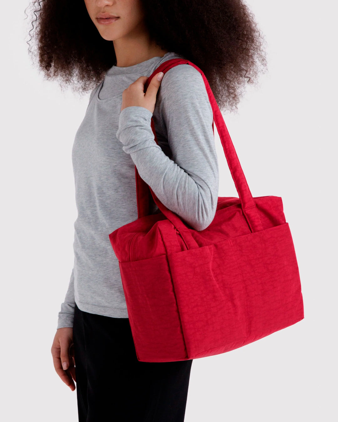 A compact carry-on built around movement. This scaled-down version of BAGGU’s Cloud series keeps the same soft structure but tightens the proportions for under-seat travel and everyday carry.