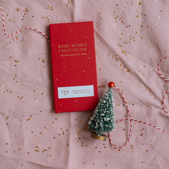 The 2025 Christmas Special chocolate bar by Bare Bones is a single-origin Peru 70% dark chocolate with appropriately festive taste notes of mince pies and cinnamon. with tree