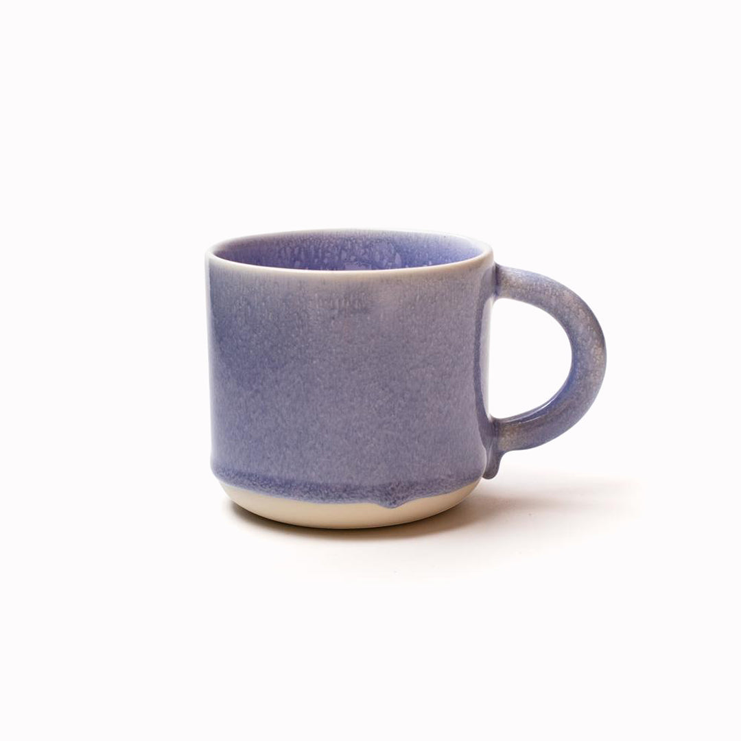 Periwinkle Blue 'Chug Mug' by Studio Arhoj features their trademark thick, hand poured coloured glaze which means that each mug is unique. 