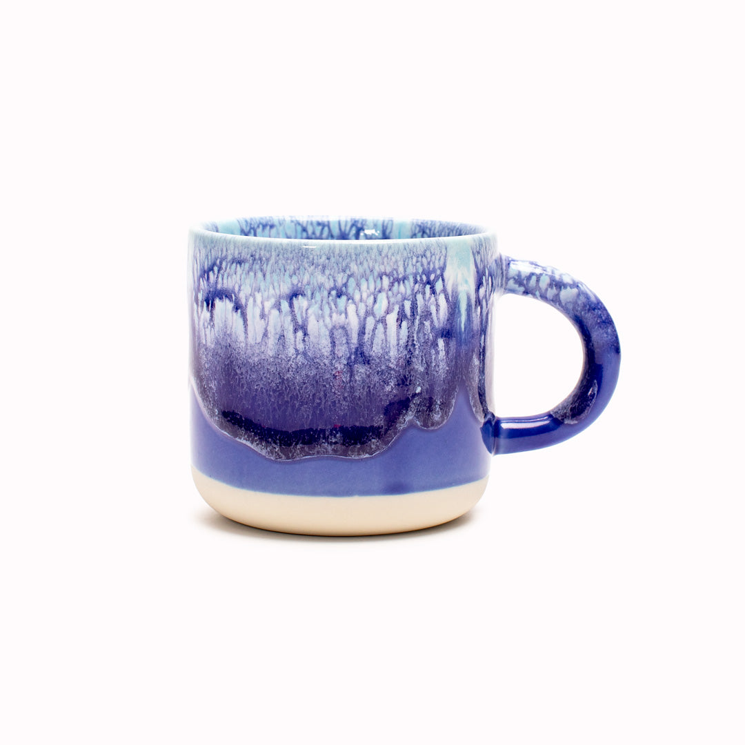 Blue over White heavy glazed, Japanese inspired ceramic mug from Studio Arhoj. The Chug Mug features their trademark thick, hand poured coloured glaze which means that each mug is unique.