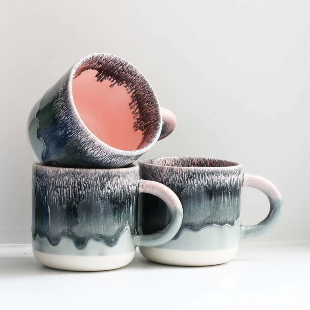 Collection. Punk Blonde, A grey over pink heavily glazed, Japanese inspired ceramic mug from Studio Arhoj. The Chug Mug features their trademark thick, hand poured coloured glaze which means that each mug is unique.