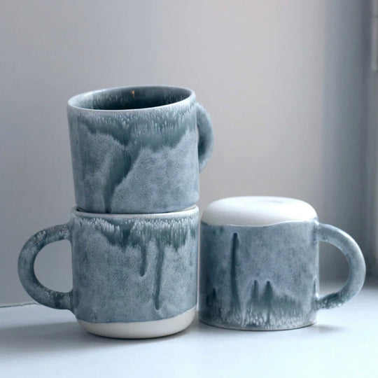 A moody grey green, heavy glazed, Japanese inspired ceramic mug from Studio Arhoj. The Chug Mug features their trademark thick, hand poured coloured glaze which means that each mug is unique.