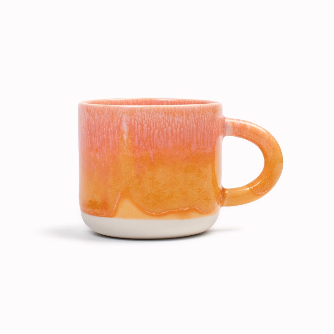 Mandarin is a heavily glazed vibrant orange, Japanese inspired ceramic mug from Studio Arhoj. The Chug Mug features their trademark thick, hand poured coloured glaze which means that each mug is unique.
